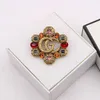 Fashion Collection 2023 New Luxury High Quality Fashion Jewelry for New hollowed out color diamond zircon inlaid Brooch anti light coat pin female
