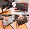 Europese en Amerikaanse dames Purse Dames Casual koppeling Trendy mobiele telefoon Tassen Simple Coin Purse Groothandel