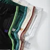 Heren shorts 2023 Multicolor Awge naalden broek Men vrouwen 1: 1 hoogwaardige elastische taille geborduurde vlinderbroek broek