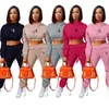 Mujeres diseñadoras de ropa de moda para mujeres trajes deportivos de calidad de color sólido color abierta ombligo acampanado set