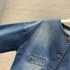 Luxurys cowboyrockar för kvinnors jeans korta fickknappar rockar nya modedesigners långärmad sml