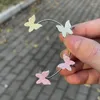 Brincos de costas 1pcs clipe de manguito de orelha de borboleta brilhante para mulheres meninas moda sem piercing colorido garoto de gancho de orelha Presente de joias