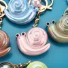 Keychains tendencia moda acrílico mágico color caracol sycchain creativo personalidad de bolsas escolares adornos para el evento