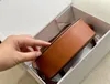 Lady Triomfes omuz crossbody yuvarlak çantalar lüks el çantası vintage kırmızı ktelya seyahat eyer çantaları cüzdanlar kadınlar erkek deri debriyaj çanta bile çanta kayışı