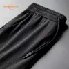 Men's Pants Ice silk breathable hole men's casual trousers beam feet pants Slim wild nine points sports fitness Fishing pants Cycling shorts Z0306