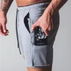 Herr shorts sommar löpning shorts män bokstav tryck elastisk midja jogging gym fitness shorts snabb torr träning avslappnad shorts byxor man 230307