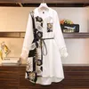 Avec une ceinture nouveau Design de mode étroit mince minorité moyenne longue robe femmes nouveau printemps noir blanc étudiant