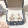 Orecchini a cerchio Da ragazza Dolce Zircone Con fiocco Con oro 18k genuino Chiusure per orecchie Coreano Di tendenza squisito Gioielli Per donna Da serata Elegante