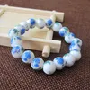 Strand pärlstav strängar armband smycken keramisk pärla färg blå och vit porslin blommor mönster vilda applikationer armband med