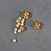 French Fashion Stud Natural Pearl Bell Orchid Asymmetriska örhängen för kvinnor nisch personlighet matt senior långa tofs smycken