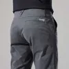 Мужские брюки мужчины повседневные брюки Slim Fit Stress Spress и осень новая кнопка моды Desinger Men's Streetwear мужская брюки Z0306