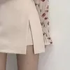 Jupes Mini jupes femmes irrégulière solide fente latérale extensible Style coréen à la mode Chic OL taille haute femme bas printemps automne 230308