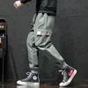 Pantaloni da uomo Pantaloni stile harem da uomo stile giapponese High Street Tasca tascabile allentata Hip Hop Pantaloni cargo maschili 5XL Pantaloni jogger casual maschili Z0306