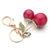 Kluczowe pierścienie Znakomite kryształowy torebka krysztonowa wisiorek czerwony wiśnia śliczna kreskówka dla samochodu dla kobiet klawisza pierścionka biżuteria K364