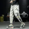 Pantaloni da uomo Streetwear Hip Hop Nero Harem Elastico in vita Punk con nastri Pantaloni da jogger slim casual 230309