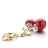 Kluczowe pierścienie Znakomite kryształowy torebka krysztonowa wisiorek czerwony wiśnia śliczna kreskówka dla samochodu dla kobiet klawisza pierścionka biżuteria K364