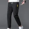 Pantalons pour hommes sport décontracté hommes été mince cordon taille élastique neuf Points séchage rapide à la mode pantalon mince hommes