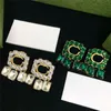 Charm Womens Double G-Letter Earrings 럭셔리 디자이너 중공 기하학적 패턴 다이아몬드 상감 이어 스터드 약혼 웨딩 쥬얼리