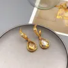 Boucles d'oreilles pendantes européennes et américaines rétro irrégulier C mot incrusté goutte d'eau femmes personnalité mode placage or 18 carats