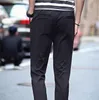Мужские брюки 2023 Случайный растяжение черные для подростков стройные ноги.