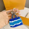 M69292 Signature Escale Speed ​​Key Holder Bag Charm Keychain Car Sleutel Ring Ring Chain Bell Naam ID Bag Tag Stamp Stempel Pouch Cles 209Q