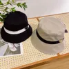 Designers de chapeau de seau Chapeaux Luxury Sunshade Men and Women Elegant Charm Fashion Tend Bons matériaux décontractés Four Seasons Gift Summer1197105