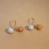S3504 Fashion Jewelry Hollowed Ball Faux Pearl Dangle örhängen för kvinnor nischdesign korsade tofsörhängen
