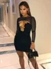 Abiti casual Macheda Sexy Mesh See Through Dress Women Pullover a maniche lunghe Crop Top e mini cinturino per spaghetti scava fuori nero