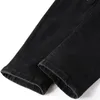 Zwarte trainingspakken Punk Slim Men's 2pcs Jeans Sets Slant Zipper Denim Jacket en gescheurde Patch Stretch Pants High Street Trendy Men Clothing