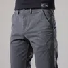 Мужские брюки мужчины повседневные брюки Slim Fit Stress Spress и осень -прибытие мода кнопка Desinger мужская одежда Уличная одежда мужская брюки 230311
