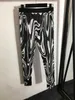 23ss Kvinnor märkesdesigner Sportkostym Zebra-tryck blommönster lapel långärmad skjorta stretch slimmade leggings set mode kvinnor Kläder a1