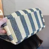 Bolso de mano de diseñador, bolso tejido, bolso tejido de hierba de colores, bolso de mujer de moda exquisita de alta belleza, bolso de playa de viaje de gran capacidad