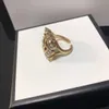 Anillo de lujo de moda Carta Diamante Diseñador Anillos envolventes Diseñadores Joyería de lujo para mujeres Anillos para hombre Moda Unisex Oro Retro Anillos casuales