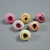 Sprzedaż hurtowa 100 sztuk sztuczna herbata kwiatowa pączek róży symulacja fałszywe Retro kamelia podsadka kwiat róży główki dekoracje ślubne DIY pudełko kolaż
