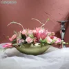 装飾的な花の花輪のセンターピースピンクプロテアシナロイドボンサイとポットレッドユリ人工花屋クリスマスアレンジパーティーイベントIndigo 230313
