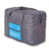 Duffel Bags Fashion Waterproof Travel Bag Stor kapacitet Kvinnor Nylon Folding Unisex Bagage Handväskor