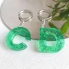 Keychains letra inicial do acrílico Titular de cor verde resina transparente Chaves de alfabetismo para bolsa de jóias artesanais diy por atacado