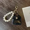 Party Favor Factory direct sale pearl bag bag pendant car key chain handmade mini bag accessories accessories pu leather d buckle wholesale