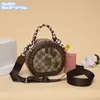 Factory ladies shoulder bags 2 colors sweet personality circular printed ribbon bag street fashion chain decorative handbag classic plaid mobile phone coin purse