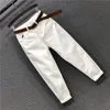 Kvinnors jeans vår mode kvinnor hög midja lösa vita jeans all-matchade casual elastiska denim bomull harembyxor s963 230314