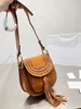 Shoulder Bags designer bag vintage fashion saddle tassel bag luxury tote wooden tote magnetic buckle men's and women's denim leather slanted crossbody bag aaa