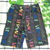 Maillots de bain Lettre colorée Impression Taille élastique Shorts décontractés Couture Mens String Pocket Design Beach Shorts Maillots de bain Trunks Designer