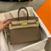 2024 Luxurys Bag Togo Leather Head Layer Lychee Grain Cow Leather Fashion Leisure Pending Large Capacity Leather for Women