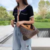 2023 Mode M45522 Geprägtes geflochtenes Handgelenk Metall gravierte Zugkette Lady Hochwertiges genarbtes Leder Hobo-Tasche Umhängetaschen Handtasche showecomfort01