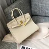 2024 Luxurys Bag Togo Leather Head Layer Lychee Grain Cow Leather Fashion Leisure Pending Large Capacity Leather for Women