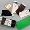 Chaussettes en forme d'échiquier vert et marron pour femmes, chaussettes tubulaires à carreaux, personnage haut de gamme, marque triangulaire, tendance