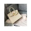 2024 Luxurys Bag Togo Leather Head Layer Lychee Grain Cow Leather Fashion Leisure Pending Large Capacity Leather for Women
