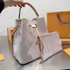 2023SS Clásico de la bolsa de asas de diseñador Bolsos de hombro de flores impresas tote diagonal de maquillaje de compras favorito de la dama