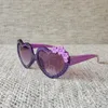 Herzförmige Fabrik-Brillen mit süßen Blumen, modische Kinder-Sonnenbrille