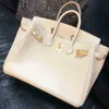 Sacs de créateurs Sacs à main Litchi Modèle Togo Cuir de veau Boucle Femmes Polyvalent Mariée Sac à main Grand sac ont 8811ess